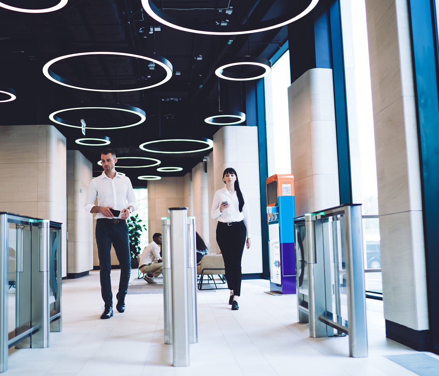 Atlas Support-Connected-flexpace-workspaces-Confident coworkers passing checkpoint at workplace